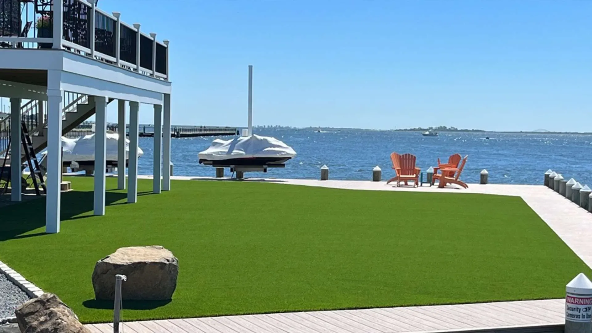 Waterfront synthetic turf lawn installation