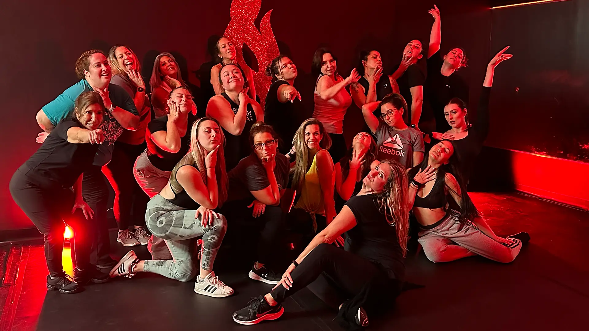 Saucy Studios class posing together after a session